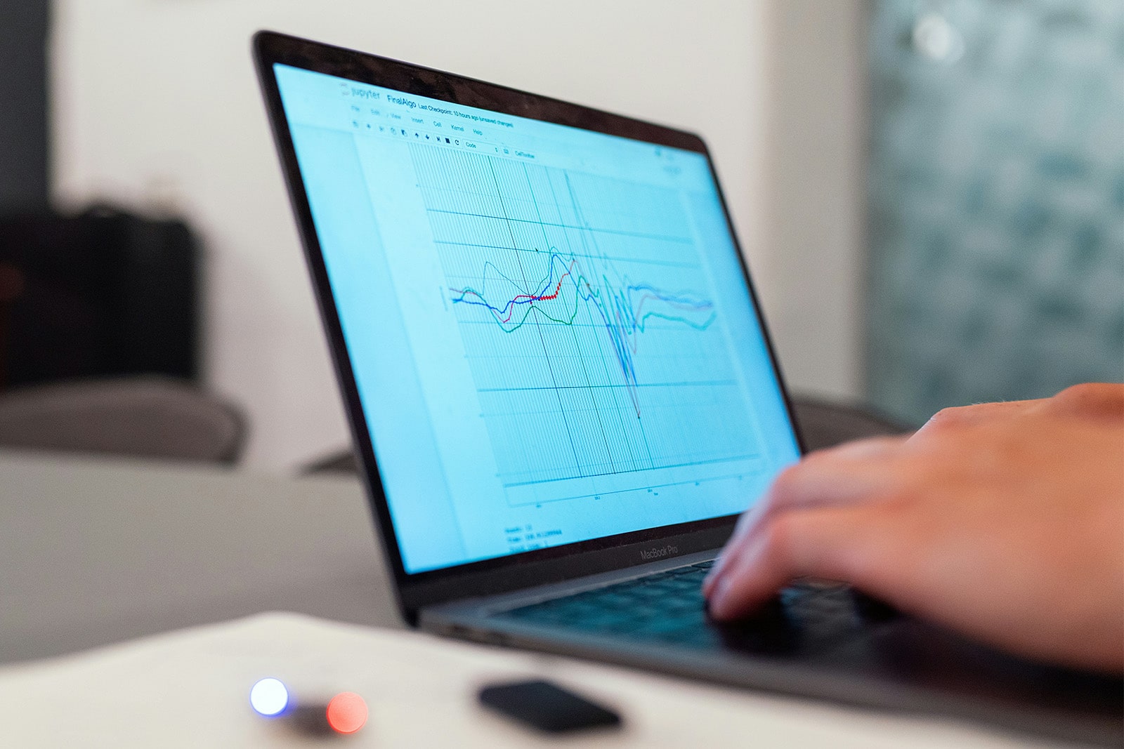 A person analysing data on a laptop