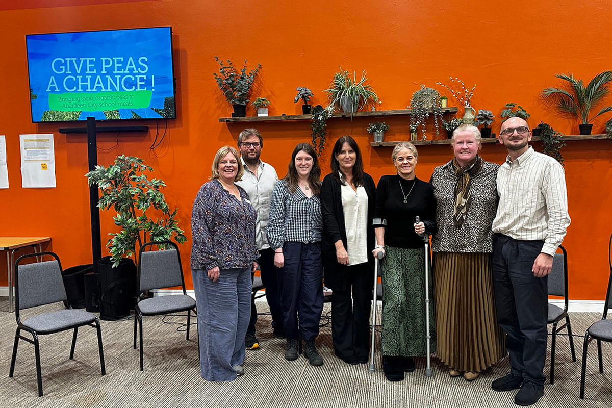 Seven stakeholders standing for a group photo at the Living Good Food Nation Lab Consortium consortium
